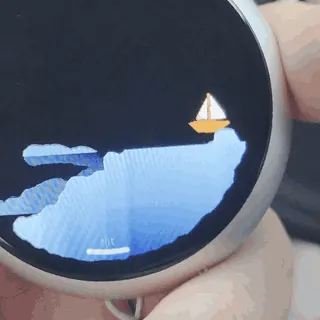 Simulación de agua moviéndose dentro de la pantalla AMOLED redonda de The Badge